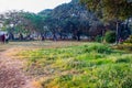 scenic view of public garden or jogging park, kids playing with ball, people jogging and Royalty Free Stock Photo