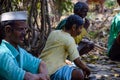 Statue of Indian villagers wearing traditions and simple cloths sitting under tree and enjoying