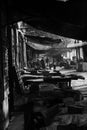 Kolkata, India - December 12, 2021: Black and white picture of a street market with closed shops on the left people walking on the Royalty Free Stock Photo