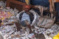 Kolkata, India - February 2, 2020: An unidentified man sleeps and rests on a lot of newspaper at Mallick Ghat flower market