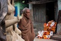 Elderly asian man stands on the street