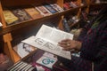 Kolkata, India- 29January, 2020 A woman is checking out collection of books in different shop in International bookfair