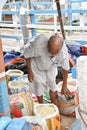 Kolkata, India-July 27,2019: Shopkeeper selling goods at Patuli Floating Market, Kolkata, India