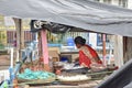 Kolkata, India-July 27,2019: Shopkeeper selling goods at Patuli Floating Market, Kolkata, India Royalty Free Stock Photo