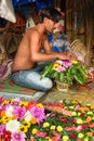 Indian seller makes basket of flowers on Flower market at Mallick Ghat in Kolkata. India Royalty Free Stock Photo