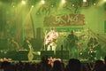 Kolkata India 1 May 2019 - Guitarist performing rock concert venue with lit bright colorful stage lights and fans or cheering Royalty Free Stock Photo