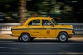 Iconic yellow taxi at Calcutta Kolkata India. The Ambassador taxi is no more built by Royalty Free Stock Photo