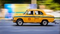 Iconic yellow taxi at Calcutta Kolkata India. The Ambassador taxi is no more built by Royalty Free Stock Photo