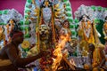 Priest worshipping Goddess Durga, Durga Puja festival celebration