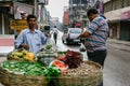 Kolkata, India - August 6, 2020 : vendor indian man selling local fresh vegetable and fruit potato, okra, banana on his