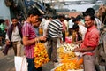 KOLKATA, INDIA: ÃÂ¡ustomers communicate with the traders of crowded flower market