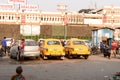 Kolkata`s yellow Ambassador car cabs parked in the prepaid taxi booth outside Sealdah station platform main entrance gate. Sealda Royalty Free Stock Photo