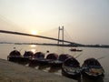 Kolkata Vidyasagar Setu bridge with boats during sunset