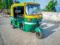 Selective focus on an auto rickshaw waiting for passengers on streets of Kolkata Royalty Free Stock Photo
