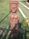 Kolkata, West Bengal/India - February 18, 2014: Tribal wooden decorated statue on green field or park openly for public at `Eco Pa