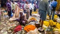 Flower sellers at the ancient bustling crowded Mullick Ghat flower market in the city