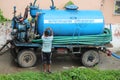 Cropped and partial view of colorful mobile municipal water tank vehicle