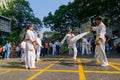 KOLKATA, WEST BENGAL, INDIA - MARCH 21ST 2015 : Young boy in white dress jumping off ground to kick, karate practice at