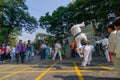 KOLKATA, WEST BENGAL, INDIA - MARCH 21ST 2015 : Young boy in white dress jumping off ground to past two fellow boys over, karate