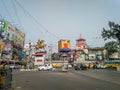 A view of Shyambazar five point crossing on a busy day with city traffic, people