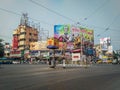 A view of Shyambazar five point crossing on a busy day with city traffic, people