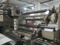 Extruder and roller running for coating polyethylene , PE on paper, for making