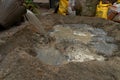 Indian labour mixing cement using shovel