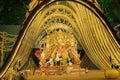 Kolkata, West Bengal, India - 12th October, 2021 : Decorated Durga idol inside pandal at night. Durga puja is Biggest festival of Royalty Free Stock Photo