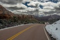 Kolob Terrace Road Winds Toward Snow Covered Mountains in Zion