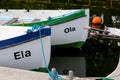 Two boats are moored at the quayside