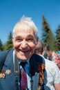 KOLOMNA, Moscow region, Russia May 9, 2015. Portrait of a happy veteran with orders and medals. Immortal Regiment