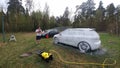 Kolomna, Russia - April 1, 2019: A man washes his car against the background of the forest. Tuned Volkswagen Golf 6 stands on the Royalty Free Stock Photo