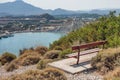 Kolymbia beach with the rocky coast and bench with a view