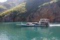 Koman, Albania, July 7 2019: A car and passenger ferry departs in Koman, Komani lake Royalty Free Stock Photo
