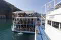 Koman, Albania, July 7 2019: Ferry is loaded with cars and passengers in Koman, Komani lake Royalty Free Stock Photo