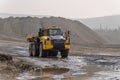 Komatsu HM400 dump truck working in an open pit.