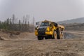 Komatsu HM400 dump truck working in an open pit.