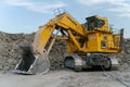 Komatsu PC4000 excavator at a coal mine. The action takes place in an open pit.