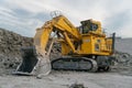 Komatsu PC4000 excavator at a coal mine. The action takes place in an open pit.