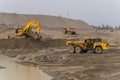 A Komatsu PC1250 excavator loads ore into a Komatsu HM400 dump truck.