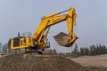 Komatsu PC1250 excavator working in an open-pit gold mine.