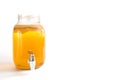 Kombucha-a drink made from tea mushroom in a glass jar with a tap. Transparent mug with a yeast drink made from a Japanese
