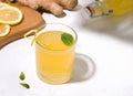 Kombucha fermented drink with ginger and lemon on a white background. Royalty Free Stock Photo