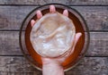 Kombucha fungus in unrecognizable man hand