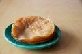 Kombucha mother or SCOBY on plate on kitchen countertop