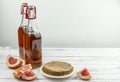 Kombucha superfood pro biotic tea fungus beverage in glass bottle with grapefruit on white background Royalty Free Stock Photo