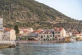 Komiza, Croatia - Aug 17, 2020: Beach Lucica in old town with crowded tourists in summer sunset Royalty Free Stock Photo