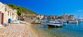 Komiza on Vis island beach and town Royalty Free Stock Photo