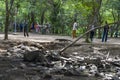 Komodo Dragon, the largest lizard in the world walks on ground. It is a dangerous prehistoric animal. Some tourists around and the