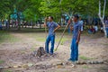 Komodo Dragon, the largest lizard in the world walks on ground. It is a dangerous prehistoric animal. Some tourists around and the